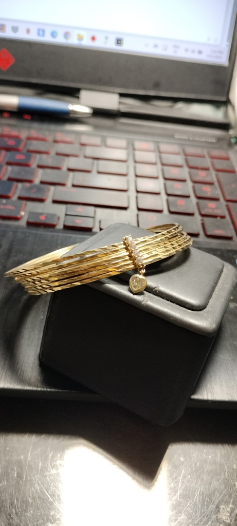 pulso semanario pulsos fijos c/barra y charmas corazon B 14k zirc B Size size7.5/11mm Weight 15.75gr