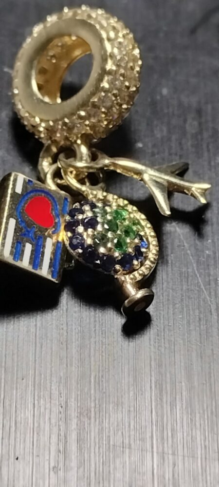 charms con avion bola mundo maleta 14k zirc B Weight 2.1gr